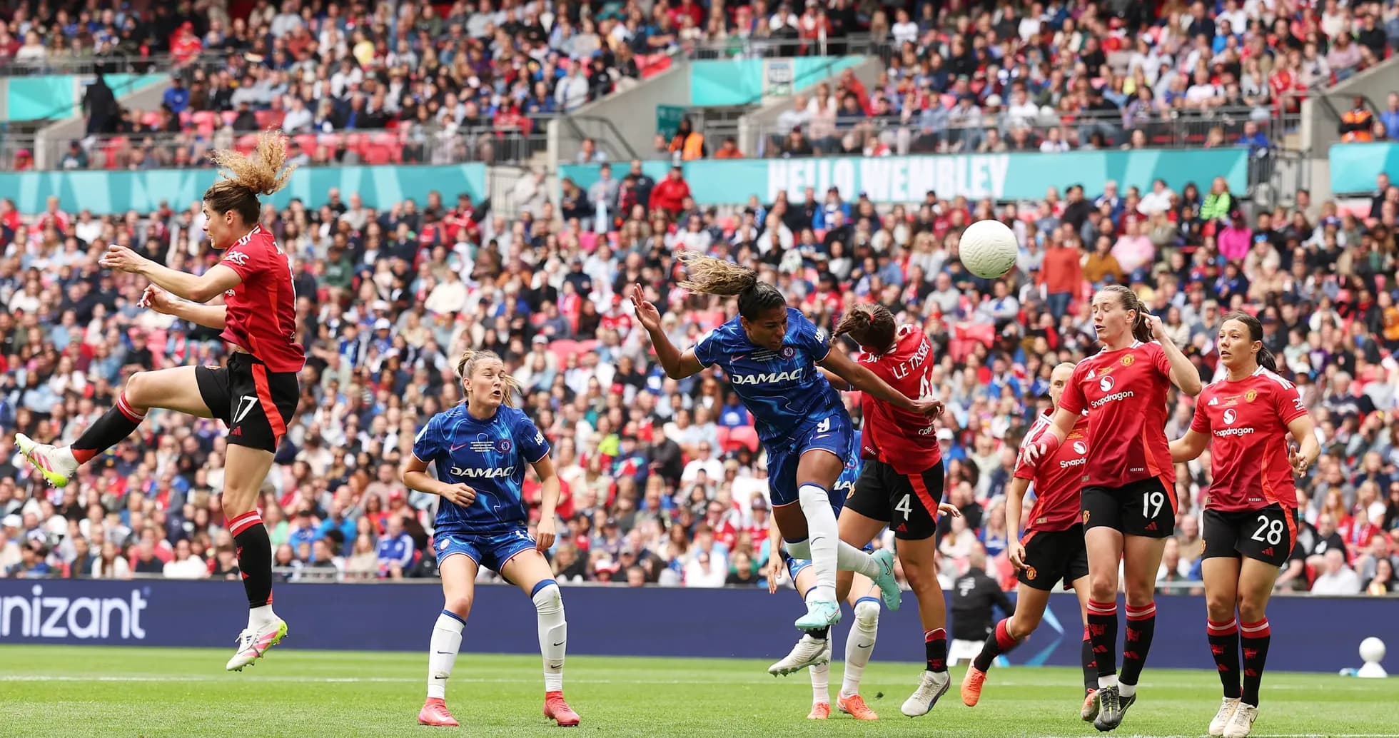 Players contesting a header during match