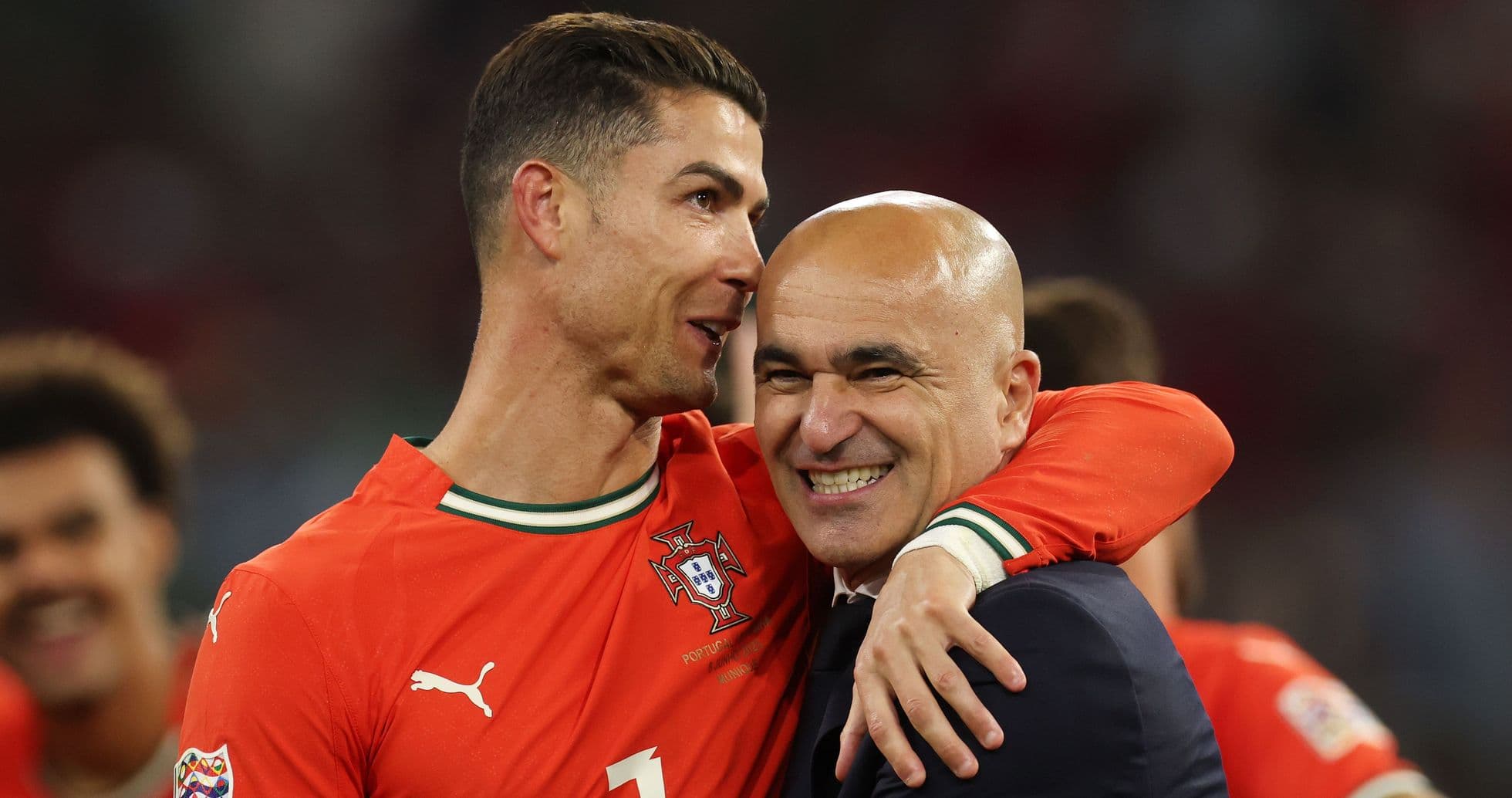Cristiano Ronaldo celebrating with coach after victory