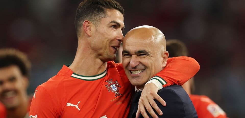 Cristiano Ronaldo celebrating with coach after victory