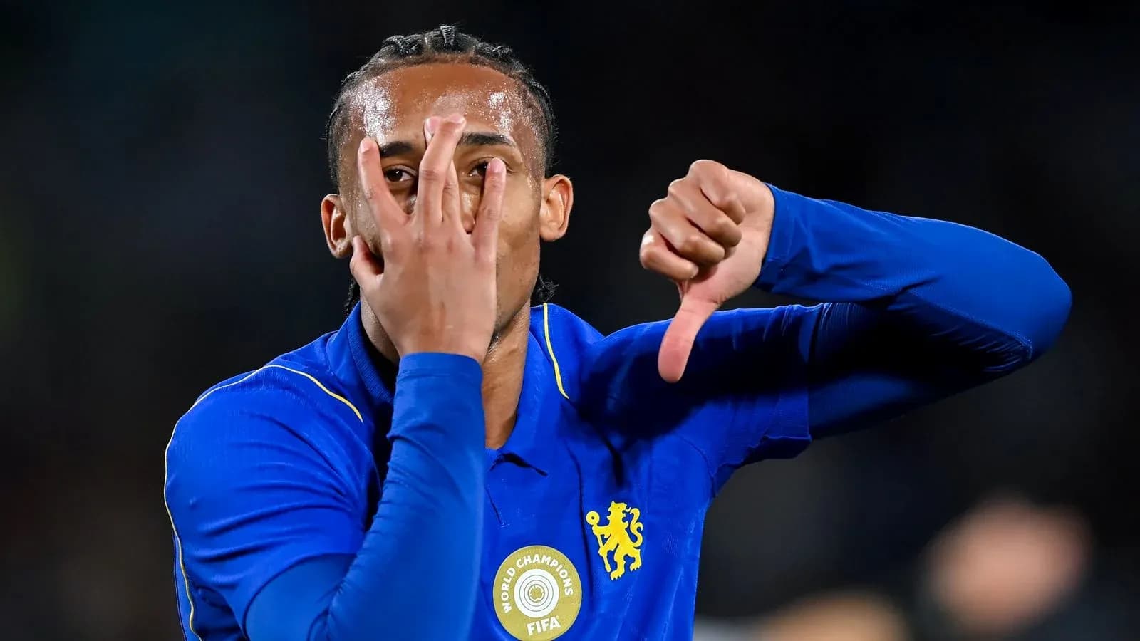 Player gesturing with hands during celebration