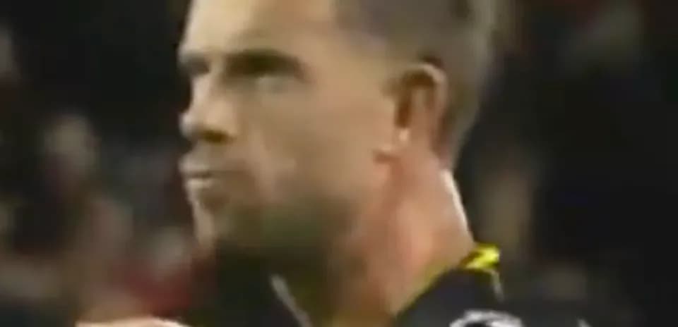 Player focused during match, wearing team uniform