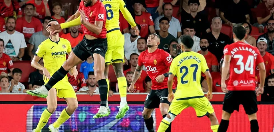 Players contesting a header during Mallorca vs Villarreal