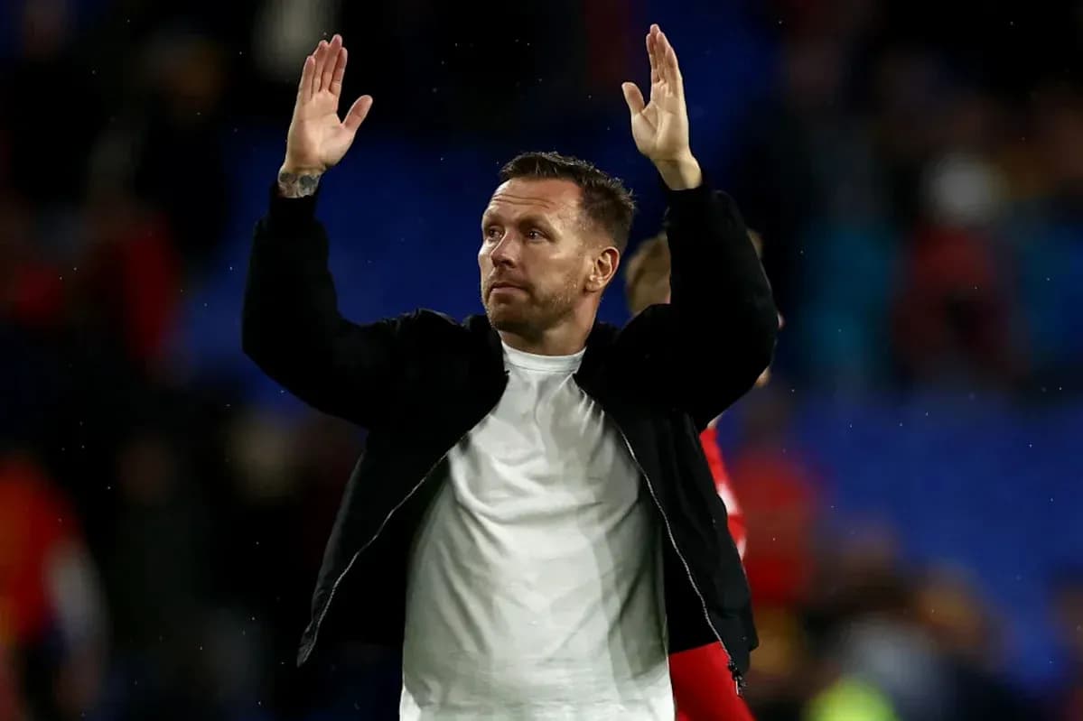 Man waving to crowd after football match
