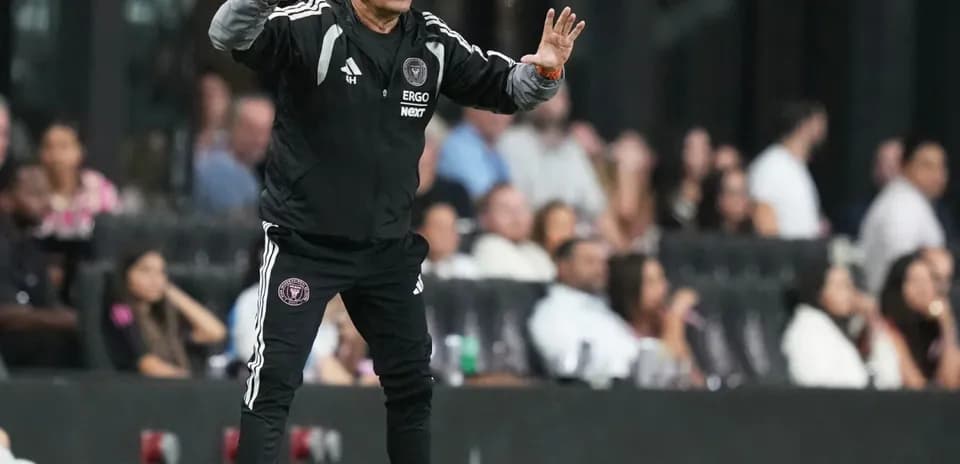 Coach giving instructions from the sideline during match