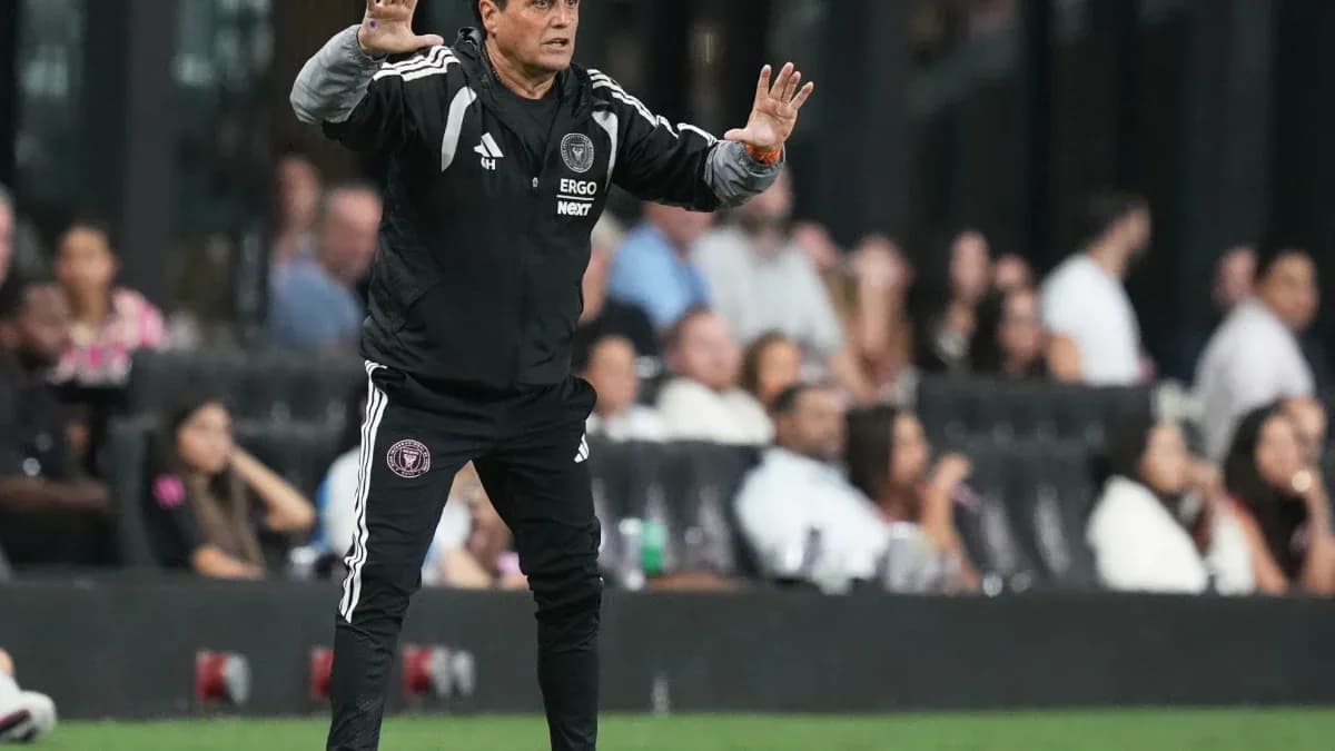 Coach giving instructions from the sideline during match