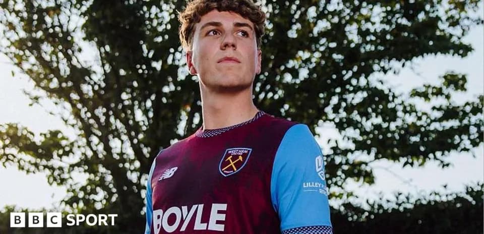 Player posing in West Ham United kit outdoors