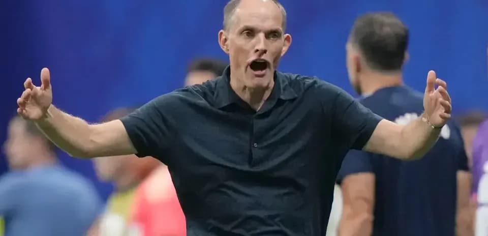 Coach gesturing during a match on the sidelines