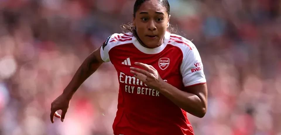 Player sprinting during a match for Arsenal
