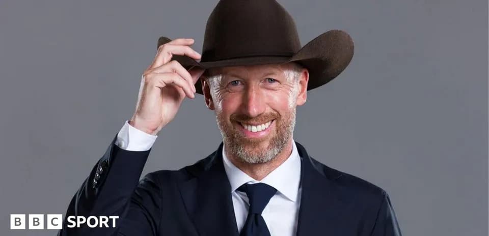 Man in suit tipping brown cowboy hat