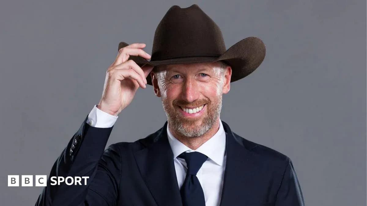 Man in suit tipping brown cowboy hat