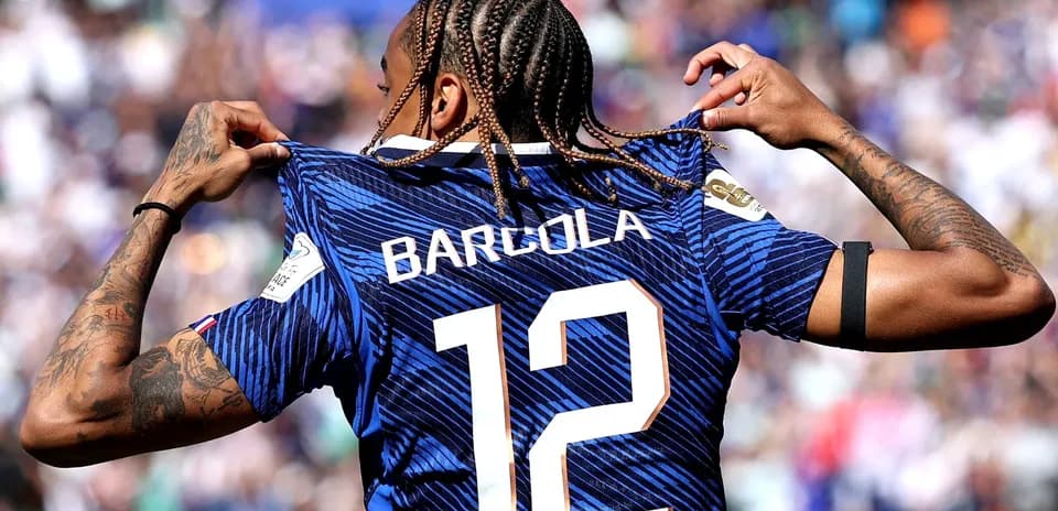 Player showcasing jersey with name Barcola and number 12