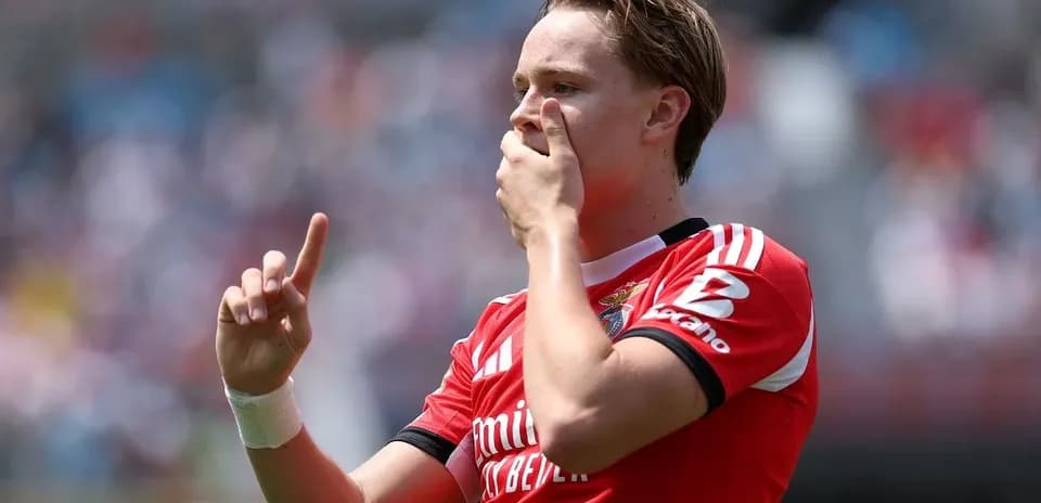 Player celebrating with hand raised during match