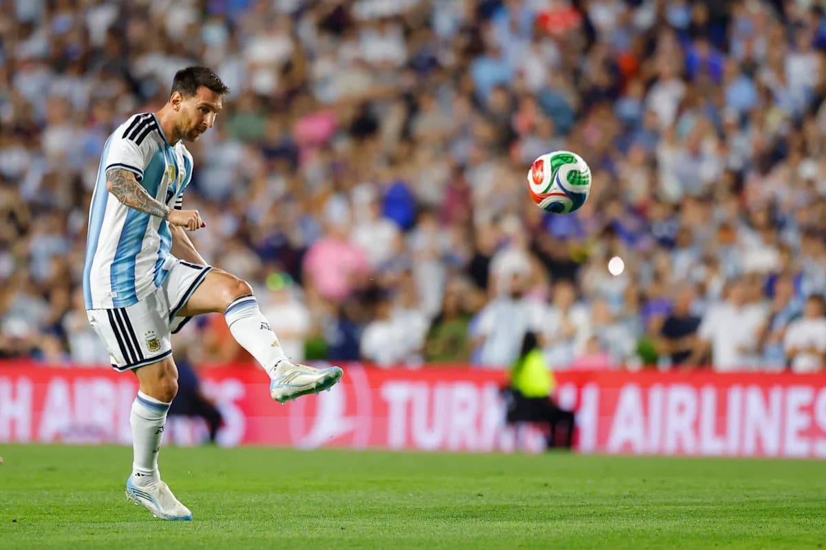 Lionel Messi preparing to kick the ball in match