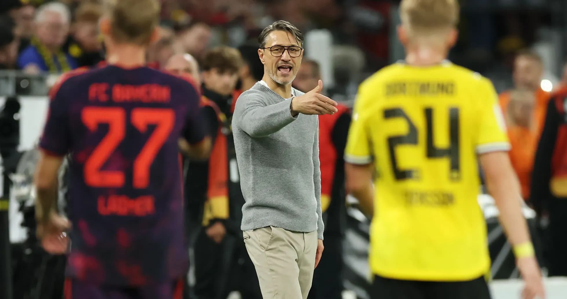 Coach directing players during a match
