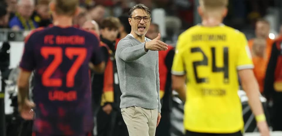 Coach directing players during a match
