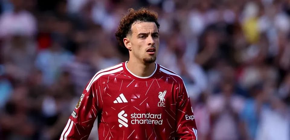 Player in red Liverpool kit during match