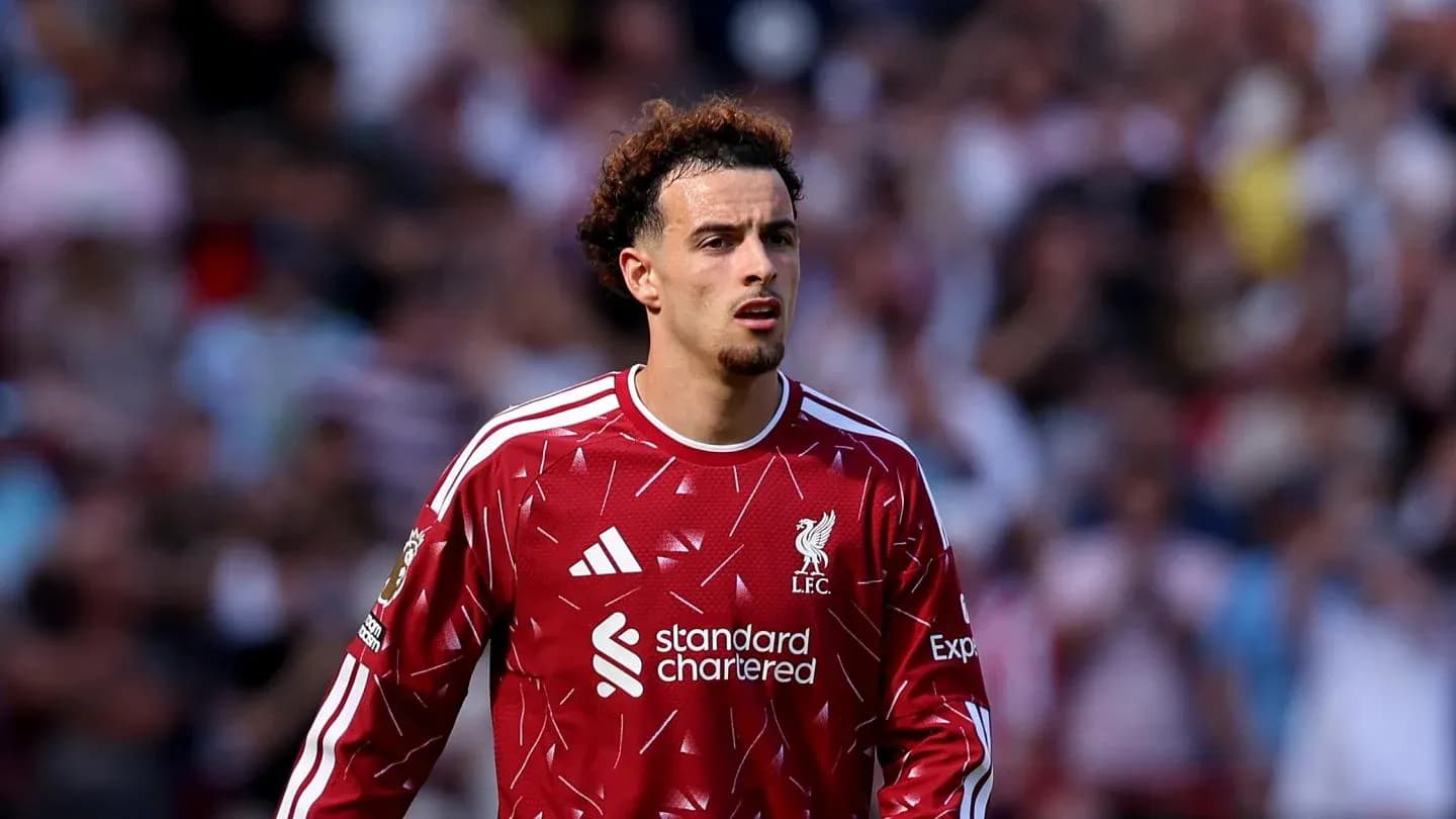 Player in red Liverpool kit during match