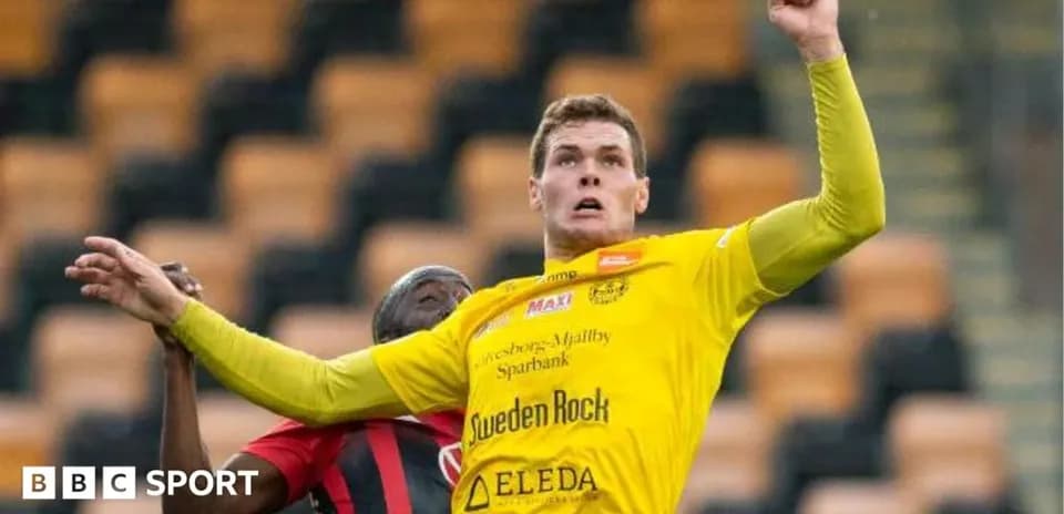 Player in yellow jersey jumping for the ball