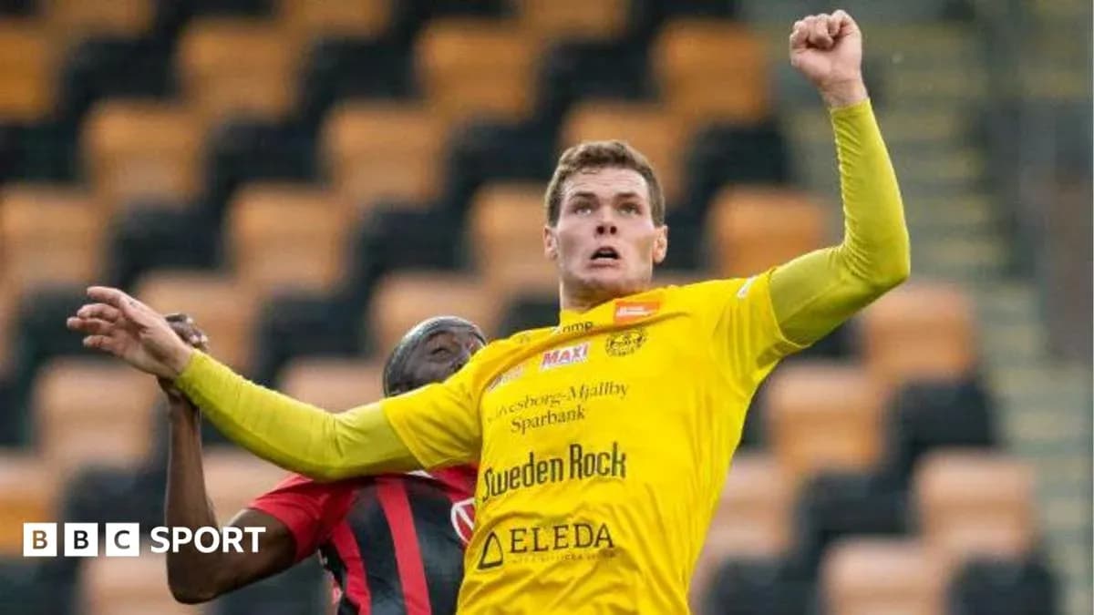 Player in yellow jersey jumping for the ball