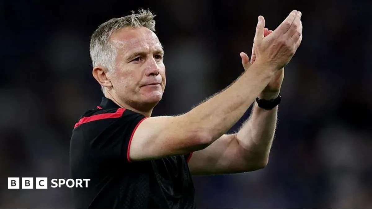 Manager applauding fans after the match