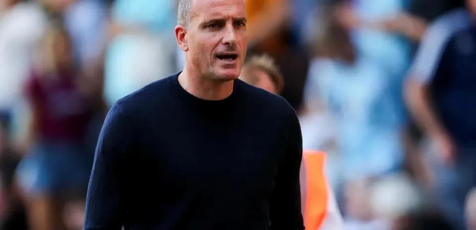Coach directing players during a match