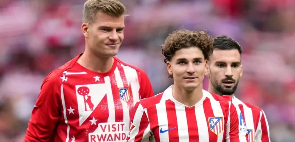 Atletico Madrid players in red and white kits