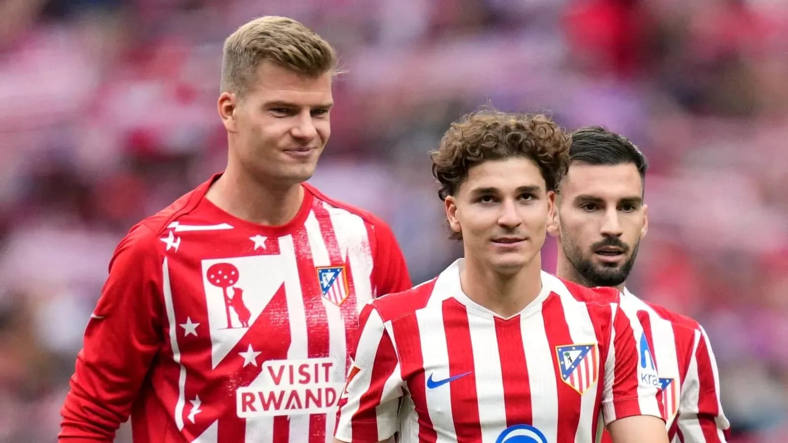 Atletico Madrid players in red and white kits
