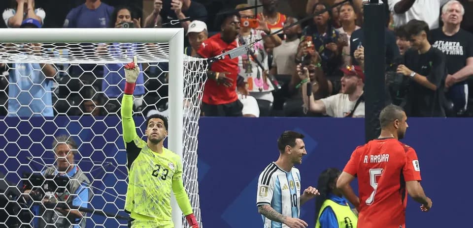 Goalkeeper celebrating with Messi and teammates during match