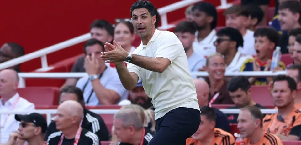 Coach directing players from the sidelines during match