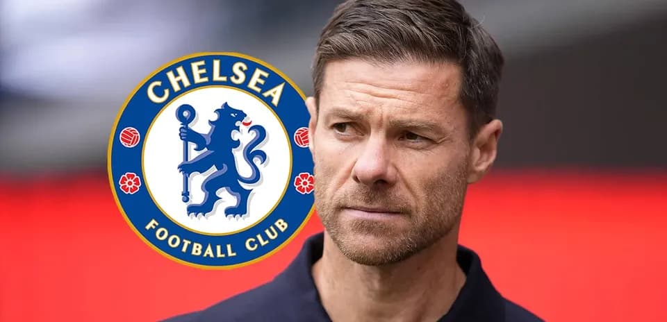 Man with Chelsea Football Club logo in background
