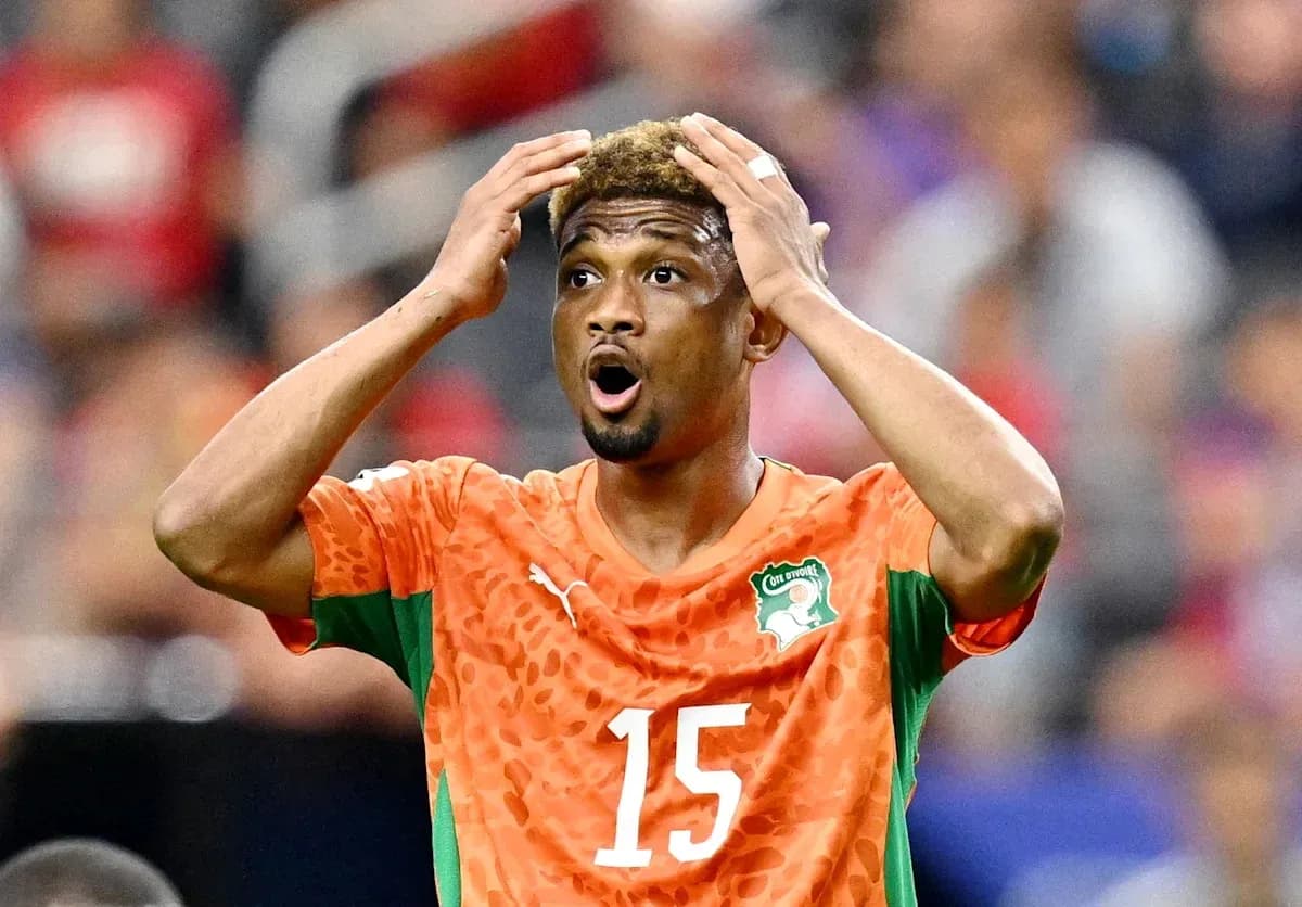 Player in orange jersey reacting during a match