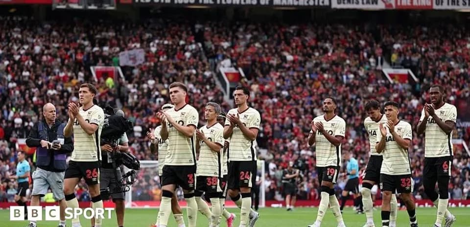 Players applauding fans after the match at stadium