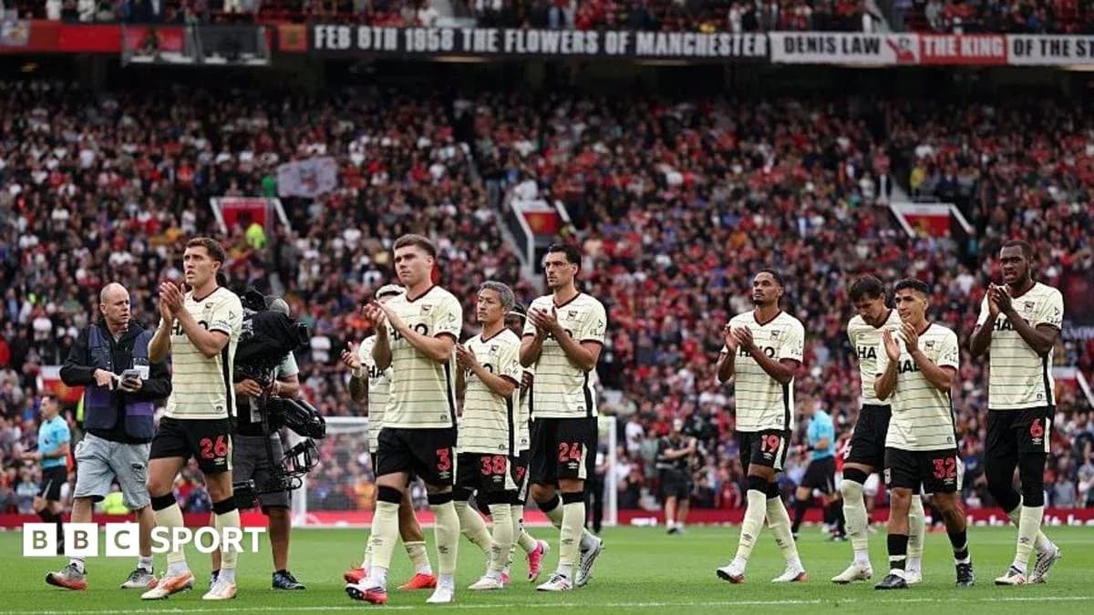 Players applauding fans after the match at stadium