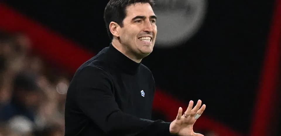 Coach gesturing during a match on the sidelines