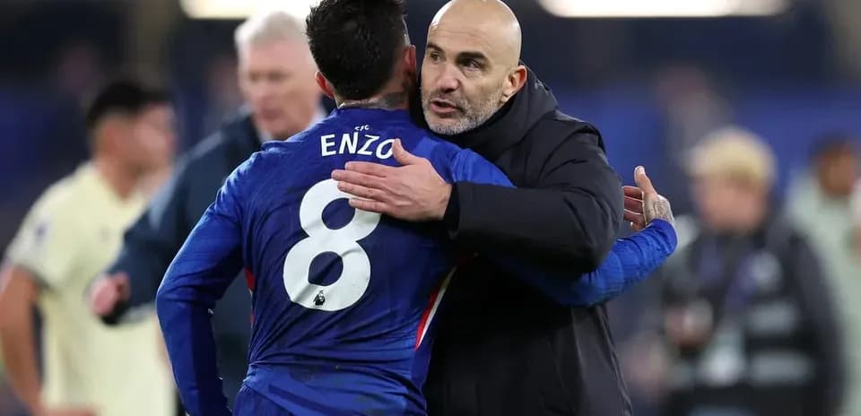 Player and coach embracing after the match