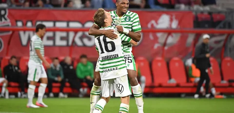 Players celebrating during a football match
