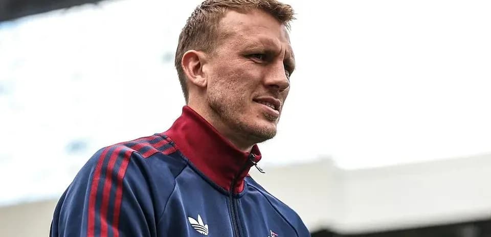 Player in training gear before match at stadium