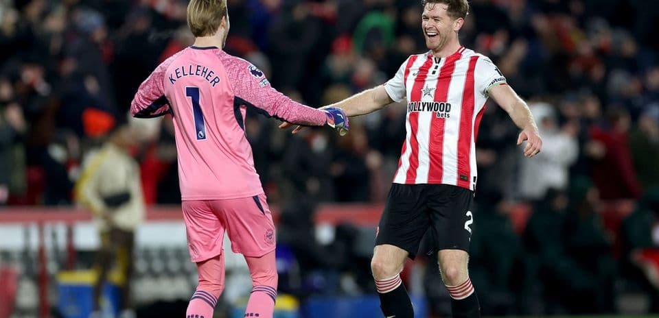 Two players celebrating after a match handshake
