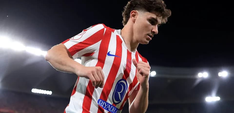 Player in red and white jersey during match