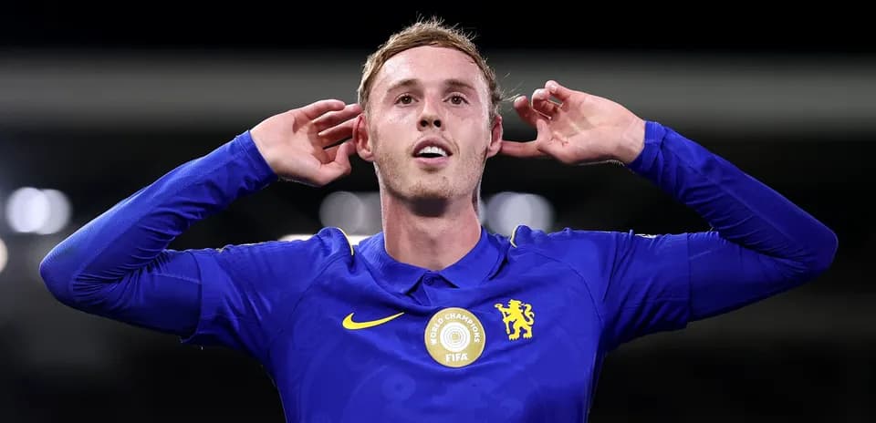Player celebrating a goal with hands on ears