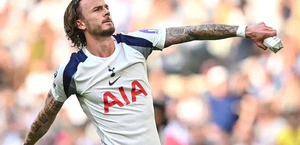 Player celebrating a goal in Tottenham jersey