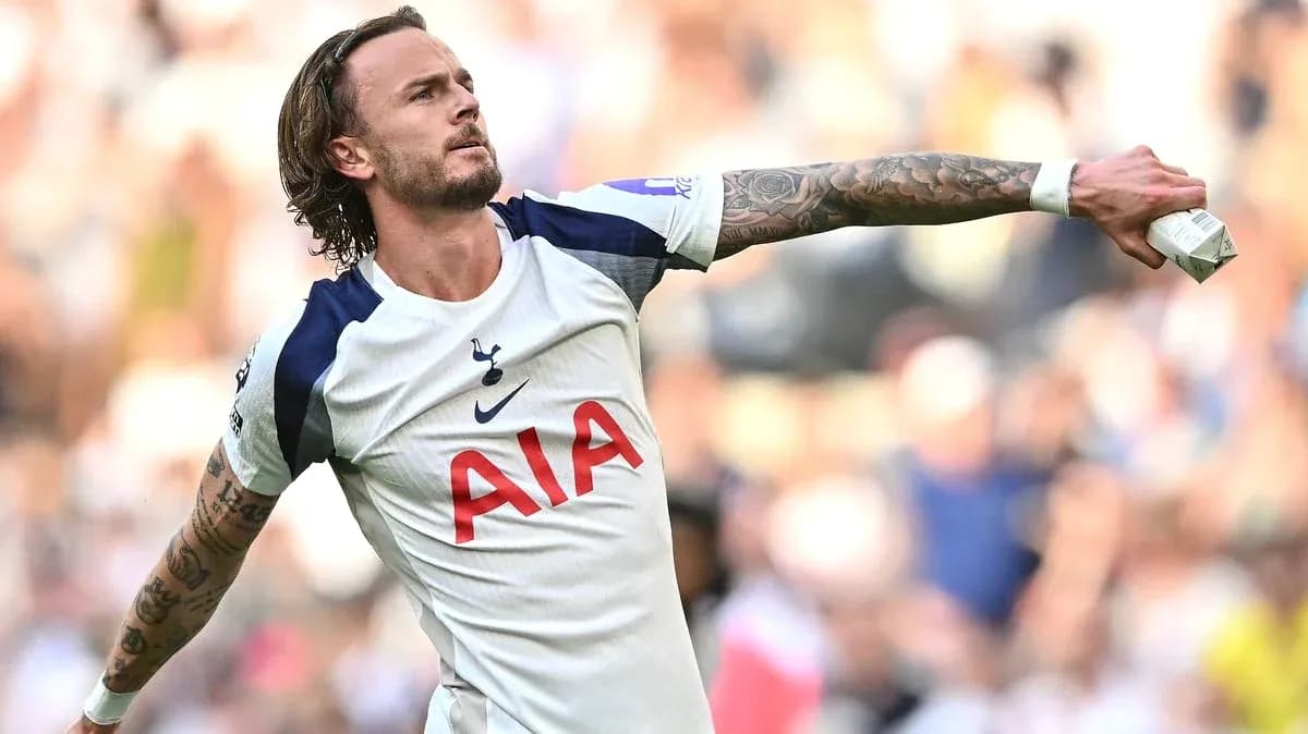 Player celebrating a goal in Tottenham jersey