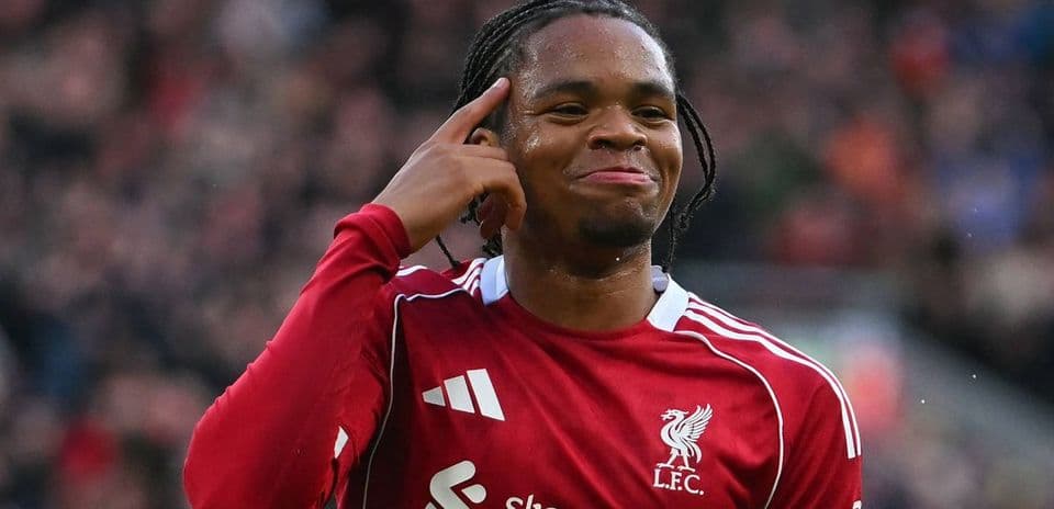 Player celebrating and pointing to his head