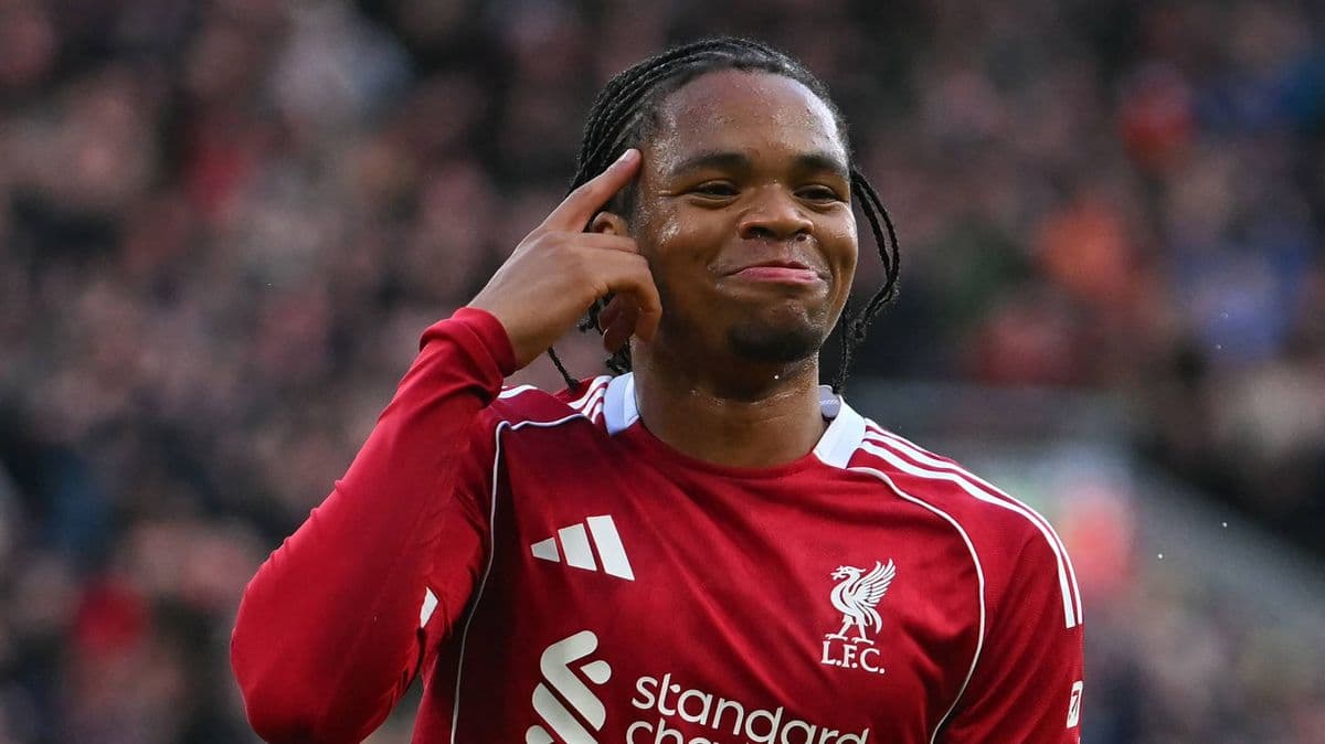 Player celebrating and pointing to his head