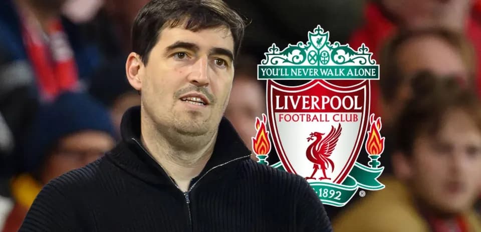 Man standing with Liverpool FC logo in background