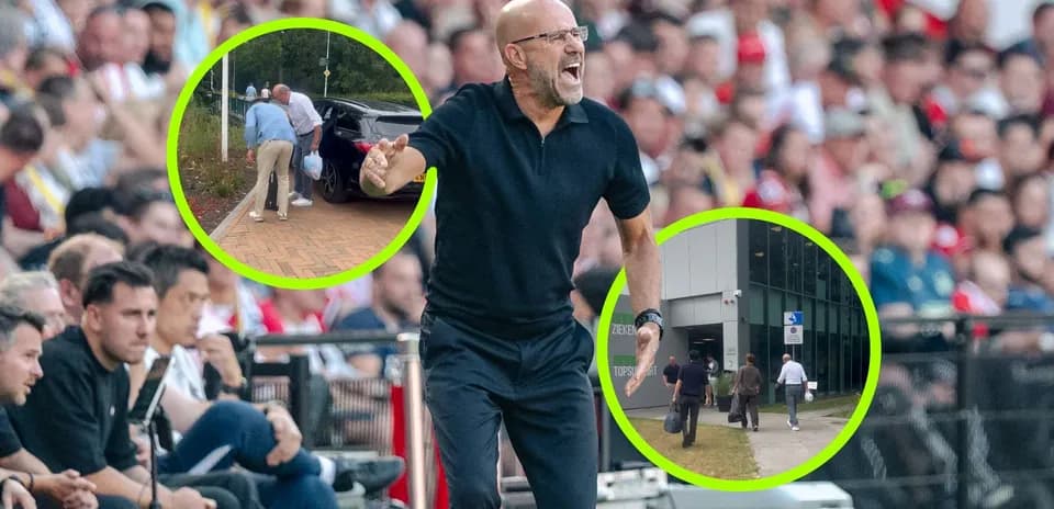 Coach gesturing passionately during match with fans behind