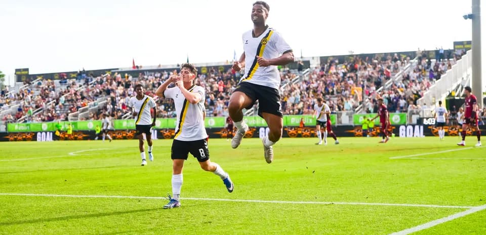Players celebrating after scoring a goal