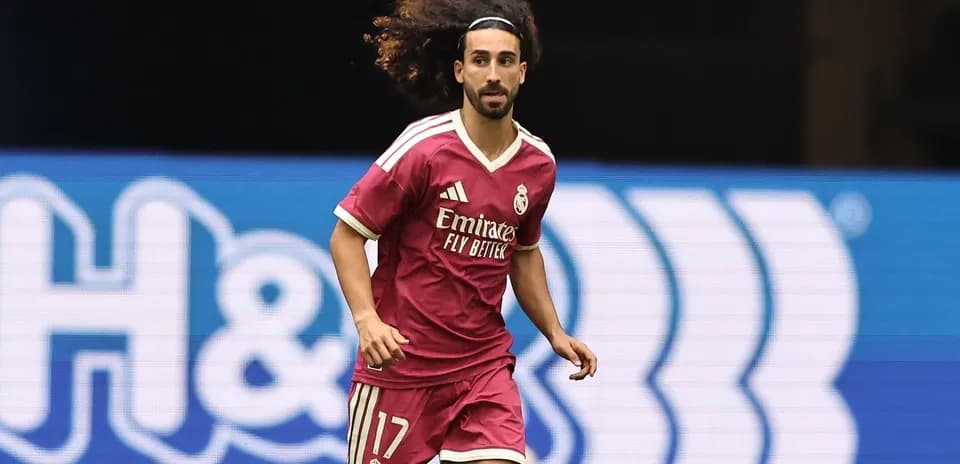 Player in pink Real Madrid kit running on field