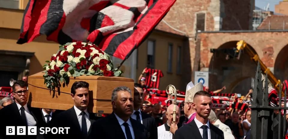 Funeral procession with coffin and supporters in background