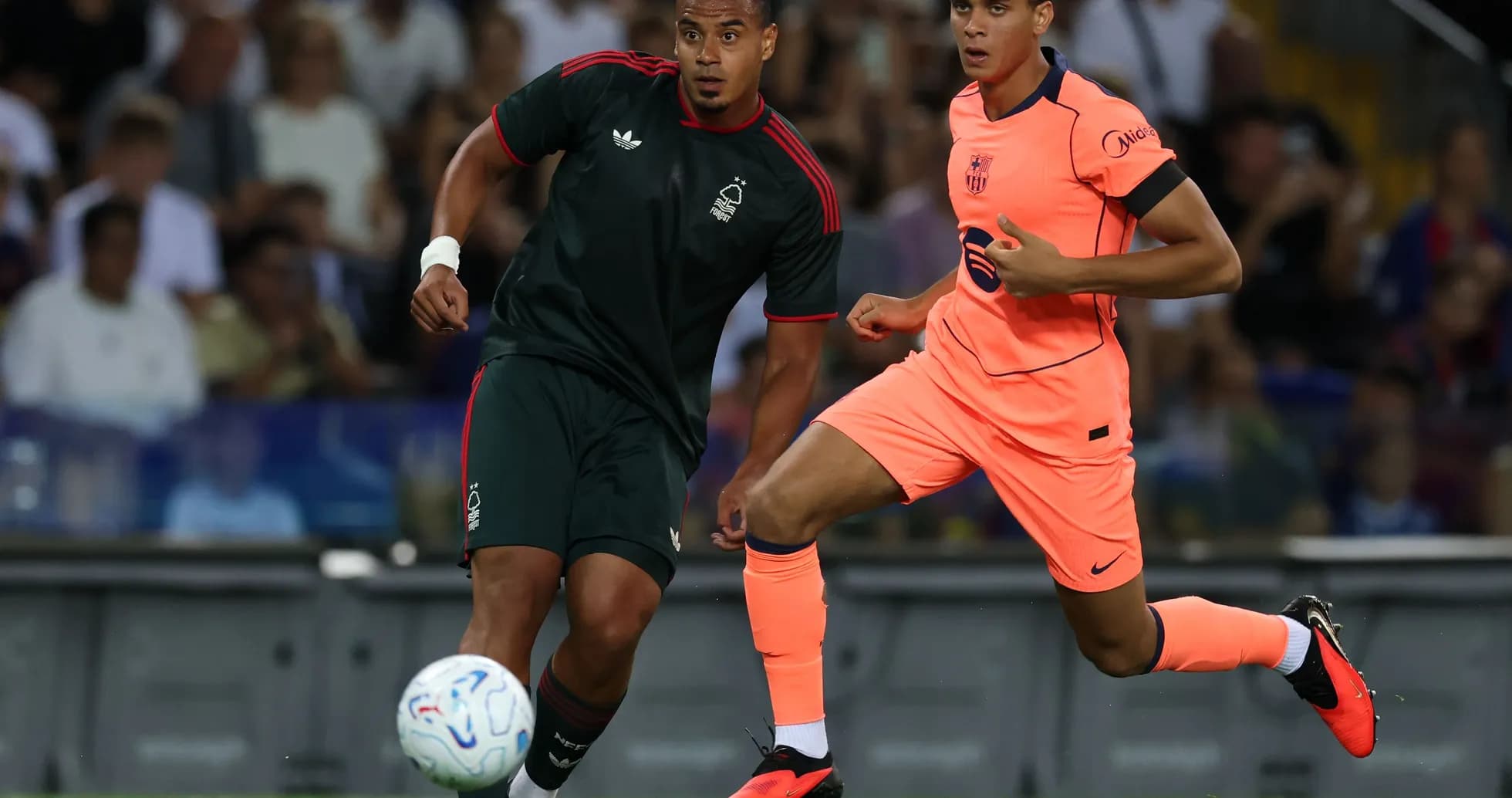 Two players competing for the ball during match